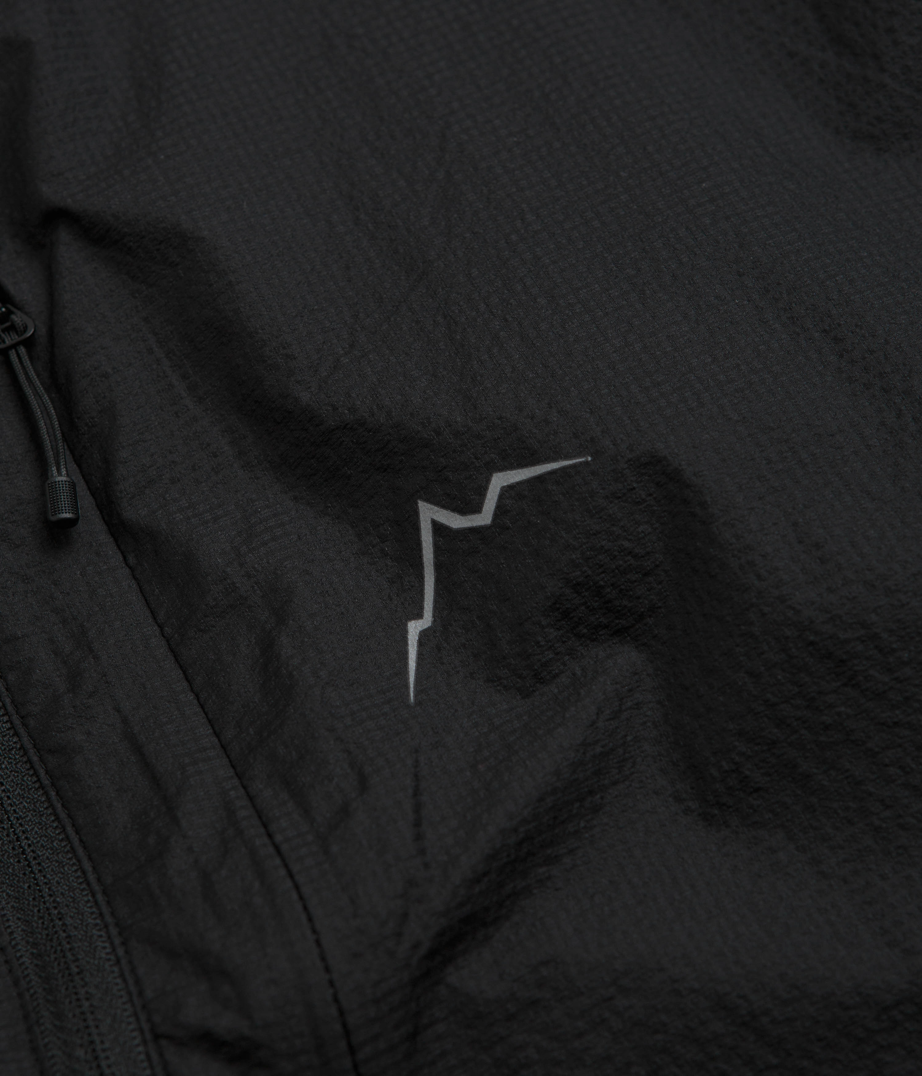 Cayl Light Air Packable Jacket - Black fireplace