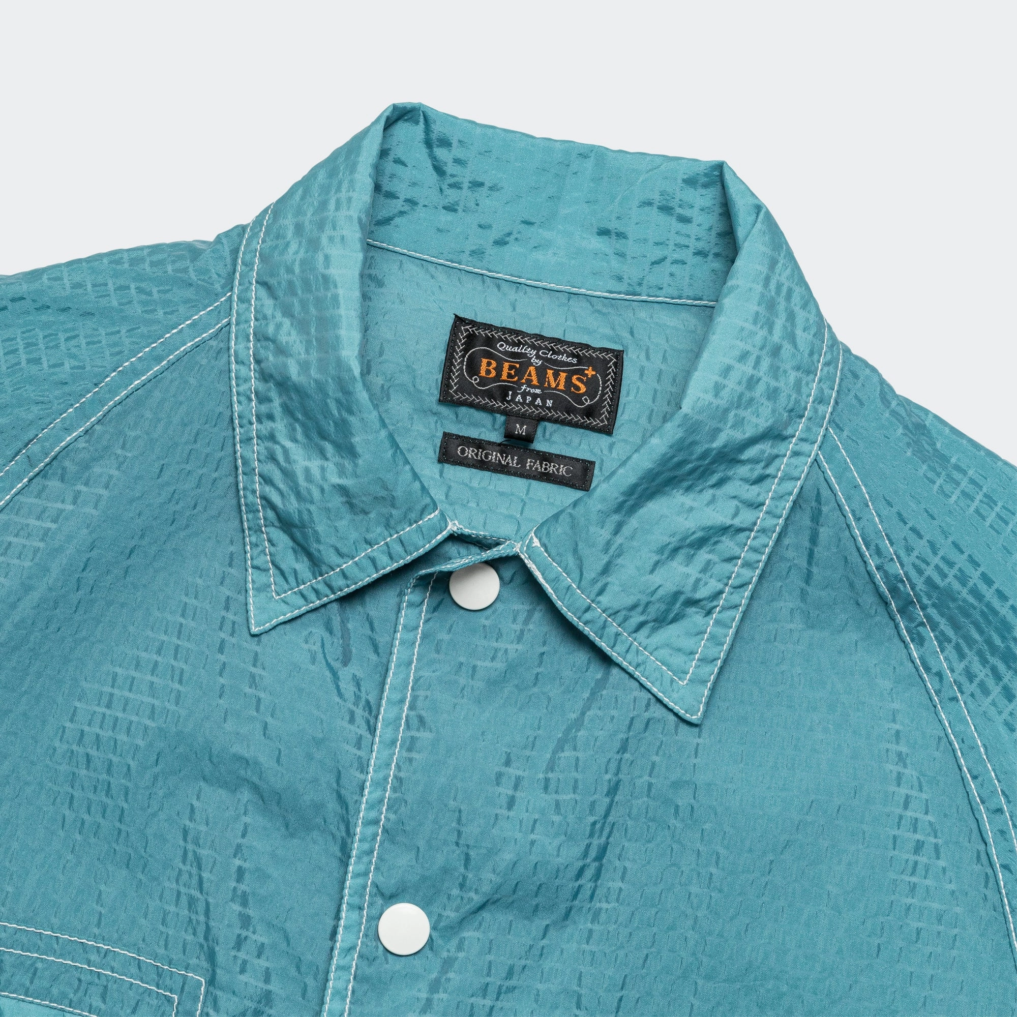 Non Restrictive Silhouette Lightweight Waterproof Jacket Sports SHT-JAC Bumpy Nylon - Sax