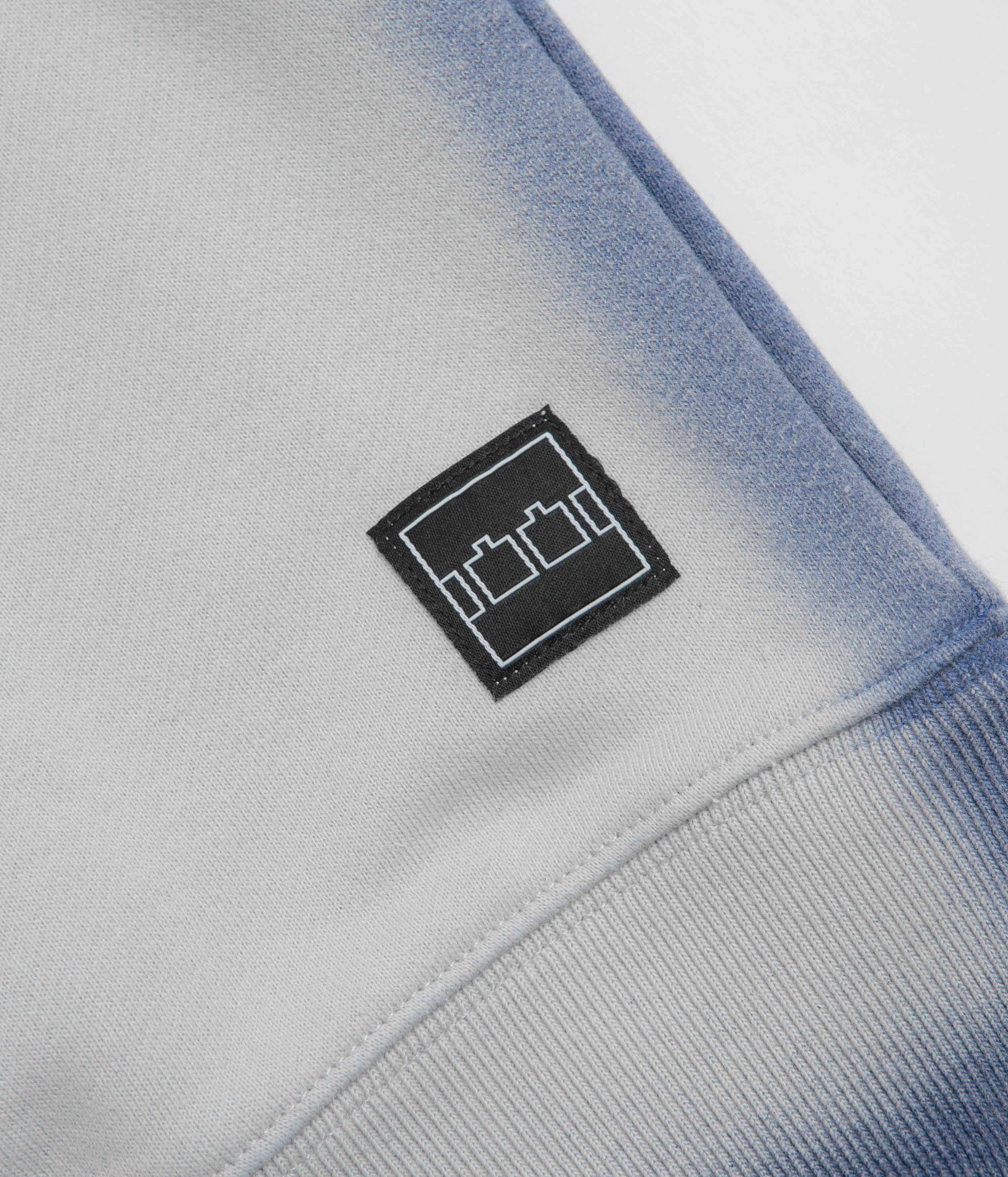 The Trilogy Tapes Overdyed Crewneck Sweatshirt - Grey / Blue tag accents